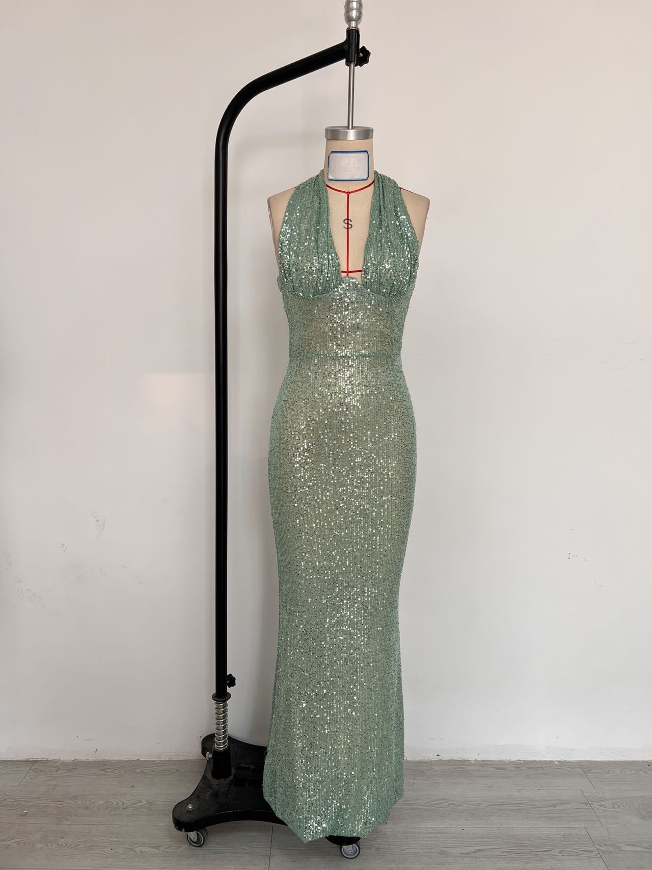 RY495 green sequin gown, supplied dress-form front photo in the original setting