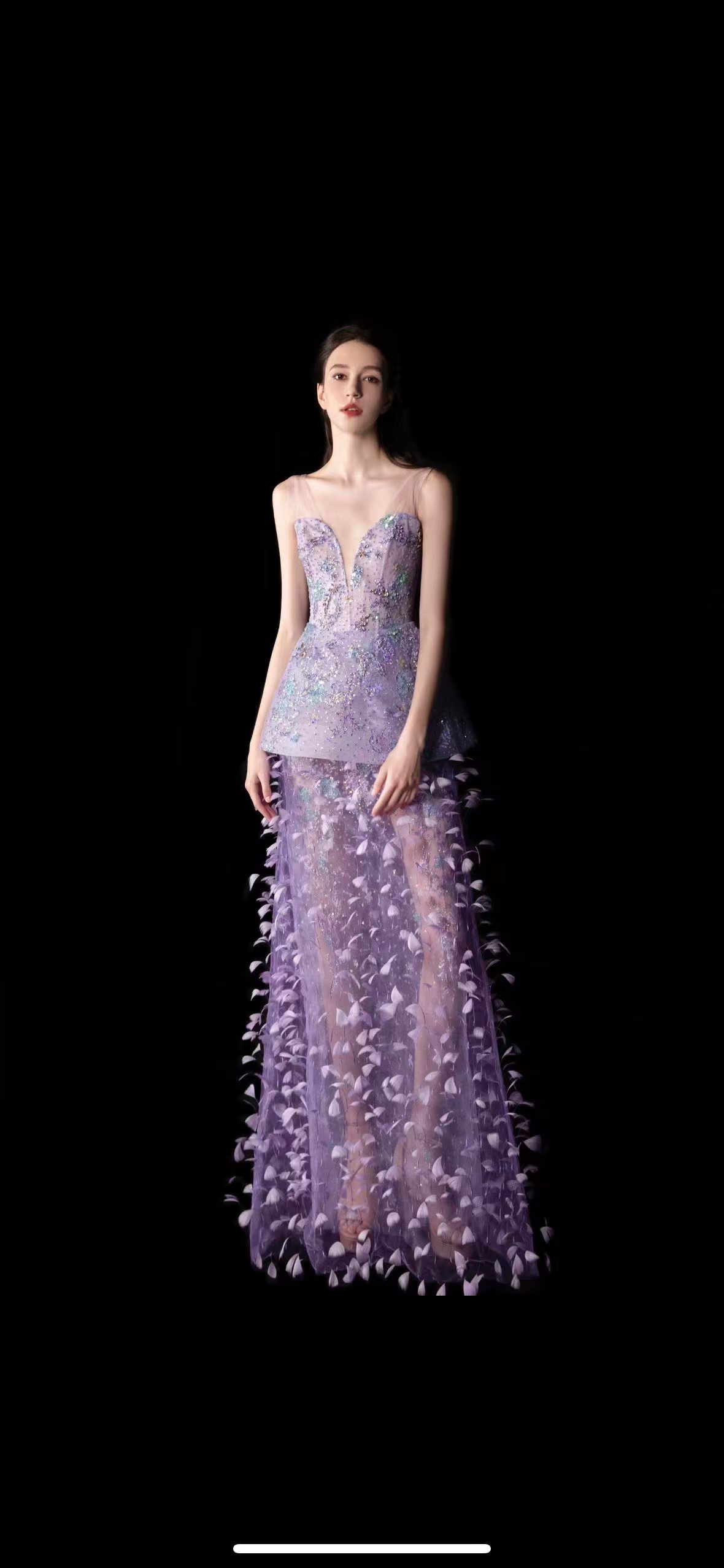Lilac evening dress with a sparkling fitted bodice and sheer skirt with dimensional feather-like details